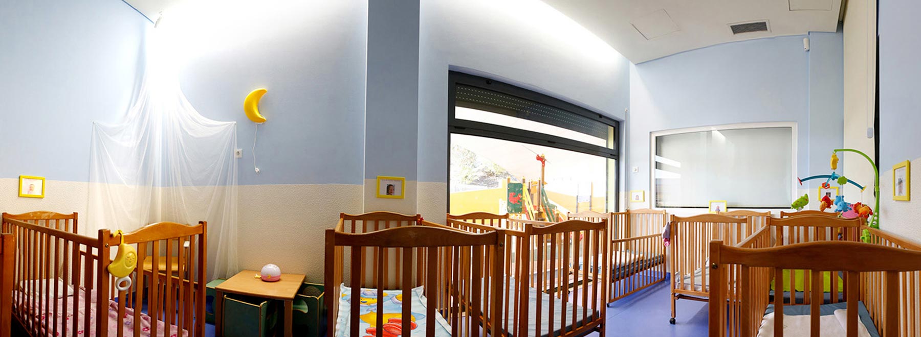Preschool nursery with cribs and toys