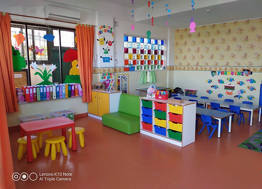 Preschool classroom with colorful furniture and decorations
