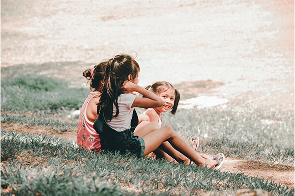Preschool children playing together outdoors