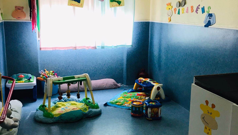 Preschool classroom with colorful toys and play area