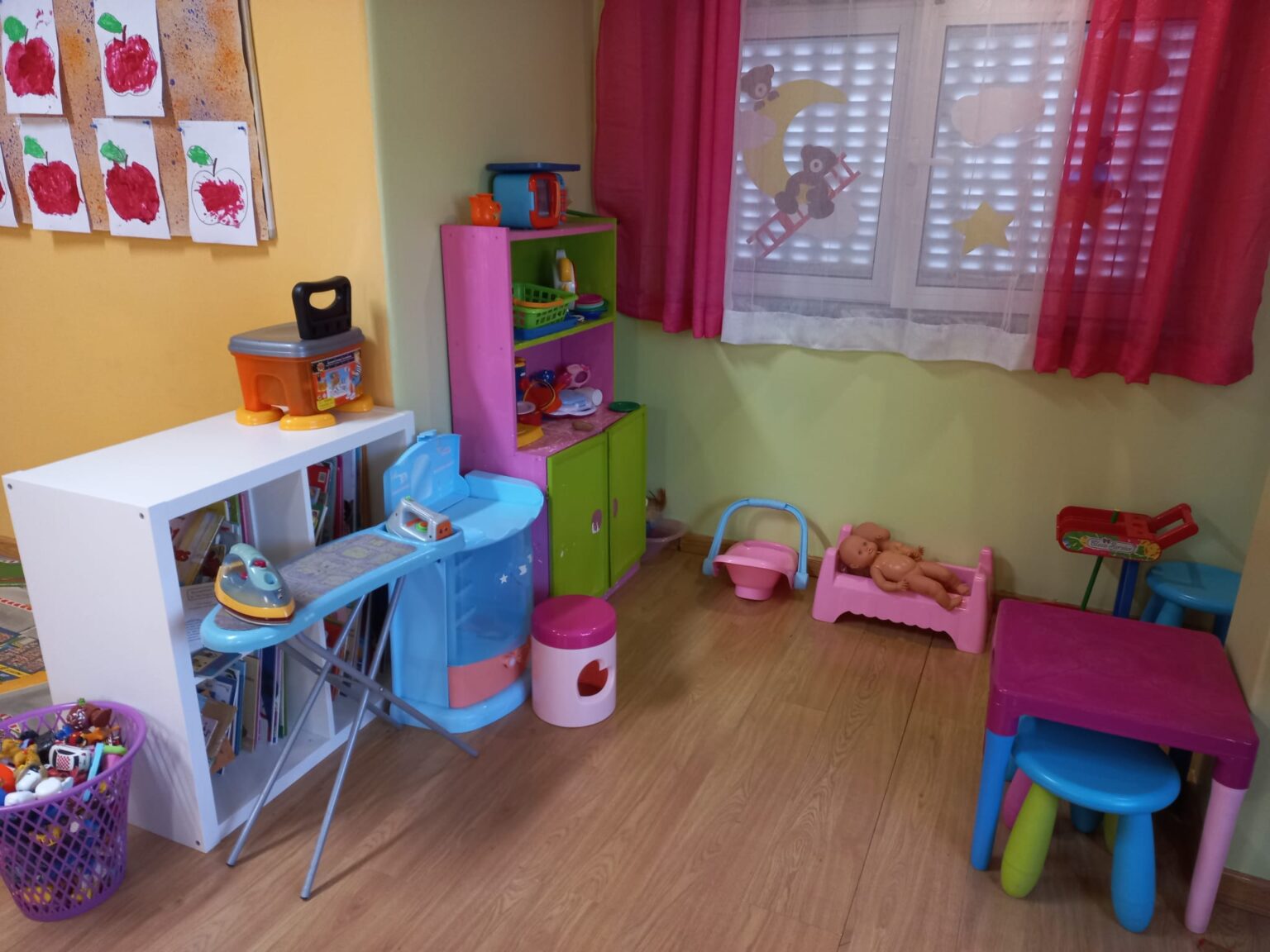 Preschool playroom with toys and play furniture