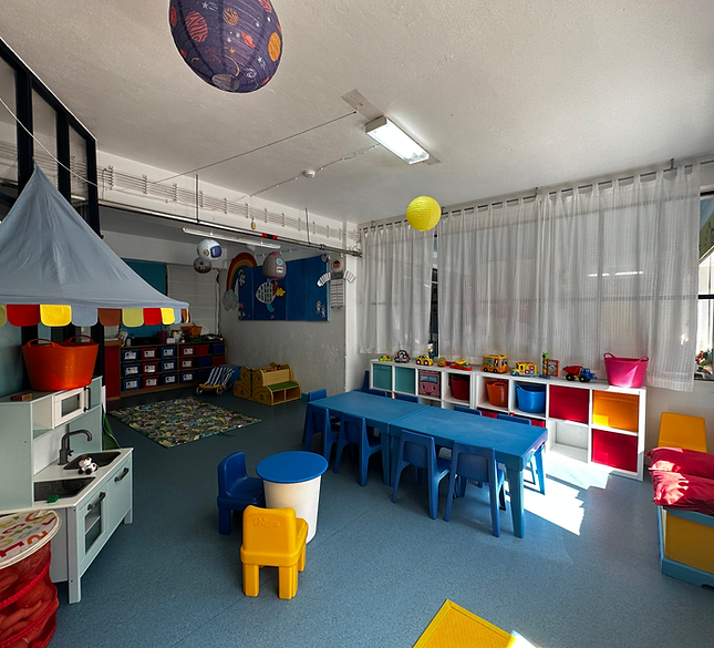 Preschool classroom with colorful furniture and toys