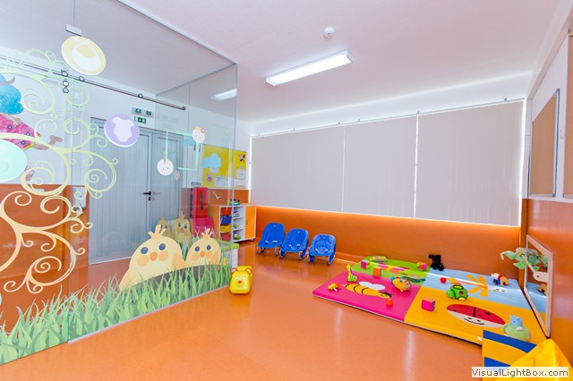 Preschool classroom with colorful toys and play area
