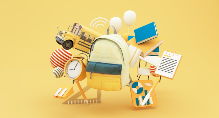Backpack with school supplies, alarm clock, school bus and books.
