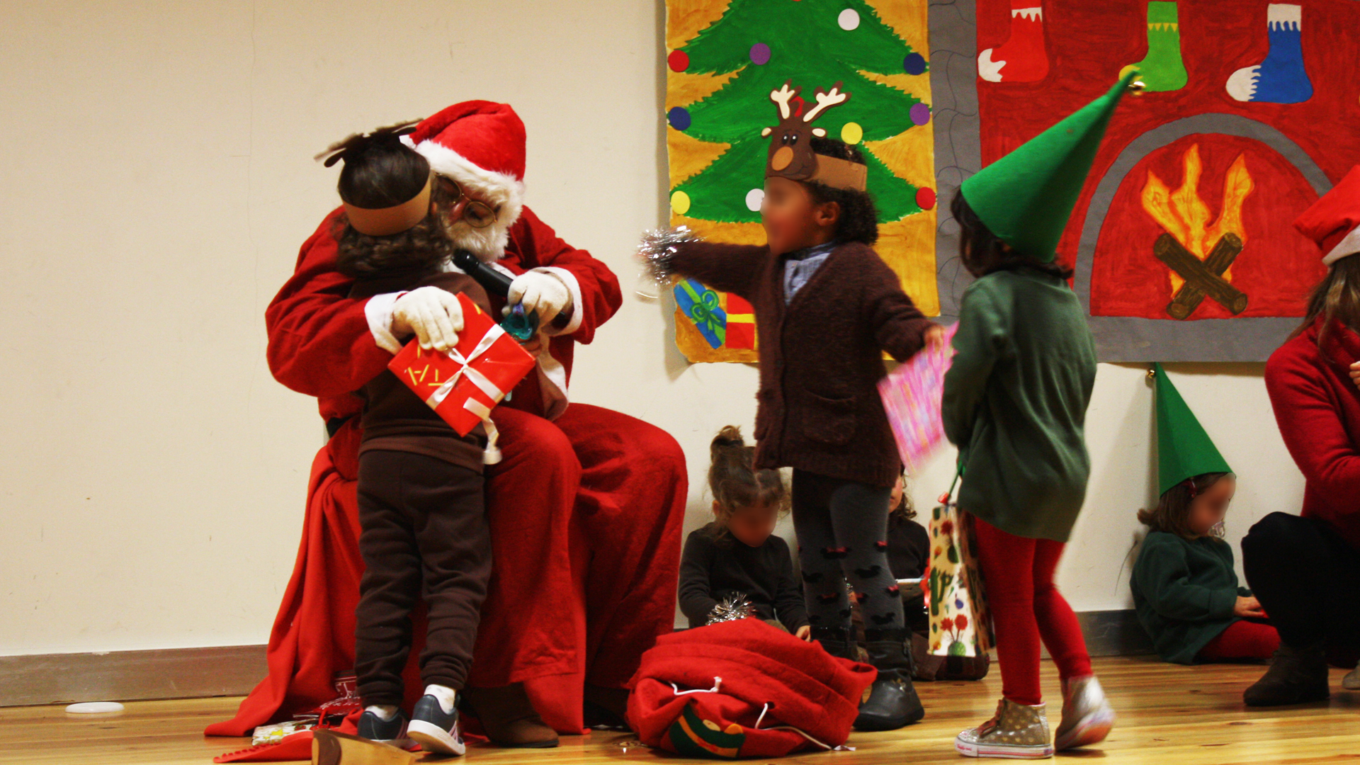 Preschool Christmas celebration with Santa Claus and children