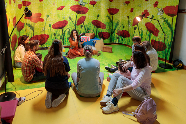 Preschool story time with children and a teacher