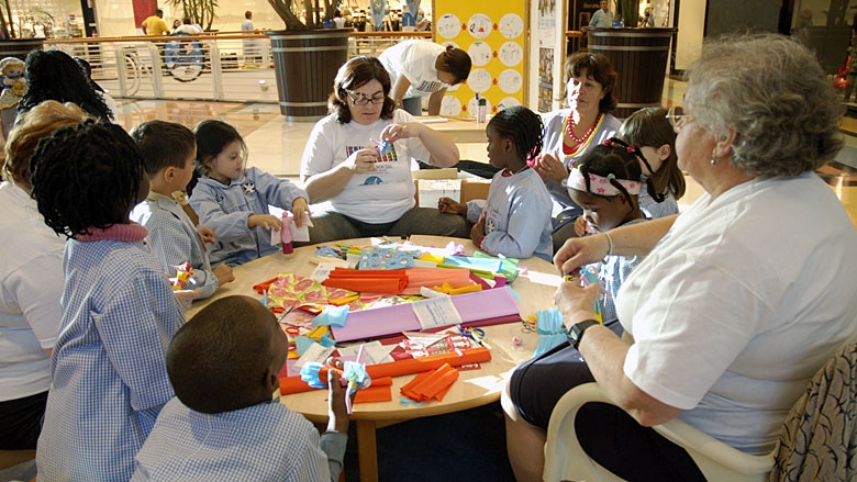 Preschool children participate in an art and craft activity.