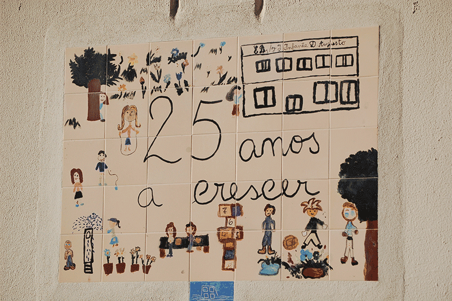 Children's drawings on tiles celebrating 25 years of the school
