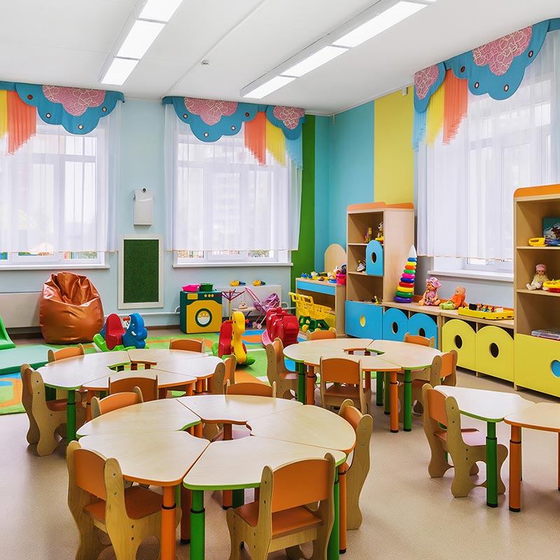 Preschool classroom with colorful furniture and toys