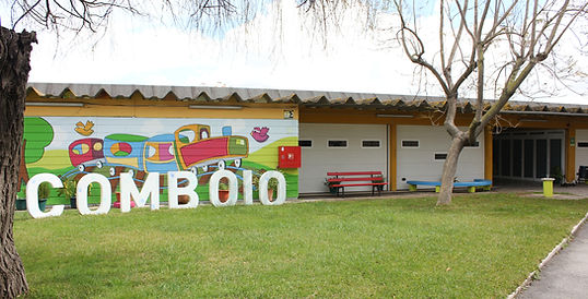Kindergarten D. Pedro V - The Train exterior with a mural of a train and the word COMBOIO