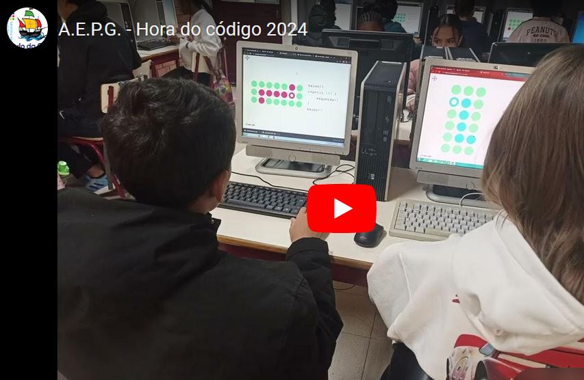 Students participate in an Hour of Code event, working on computers.