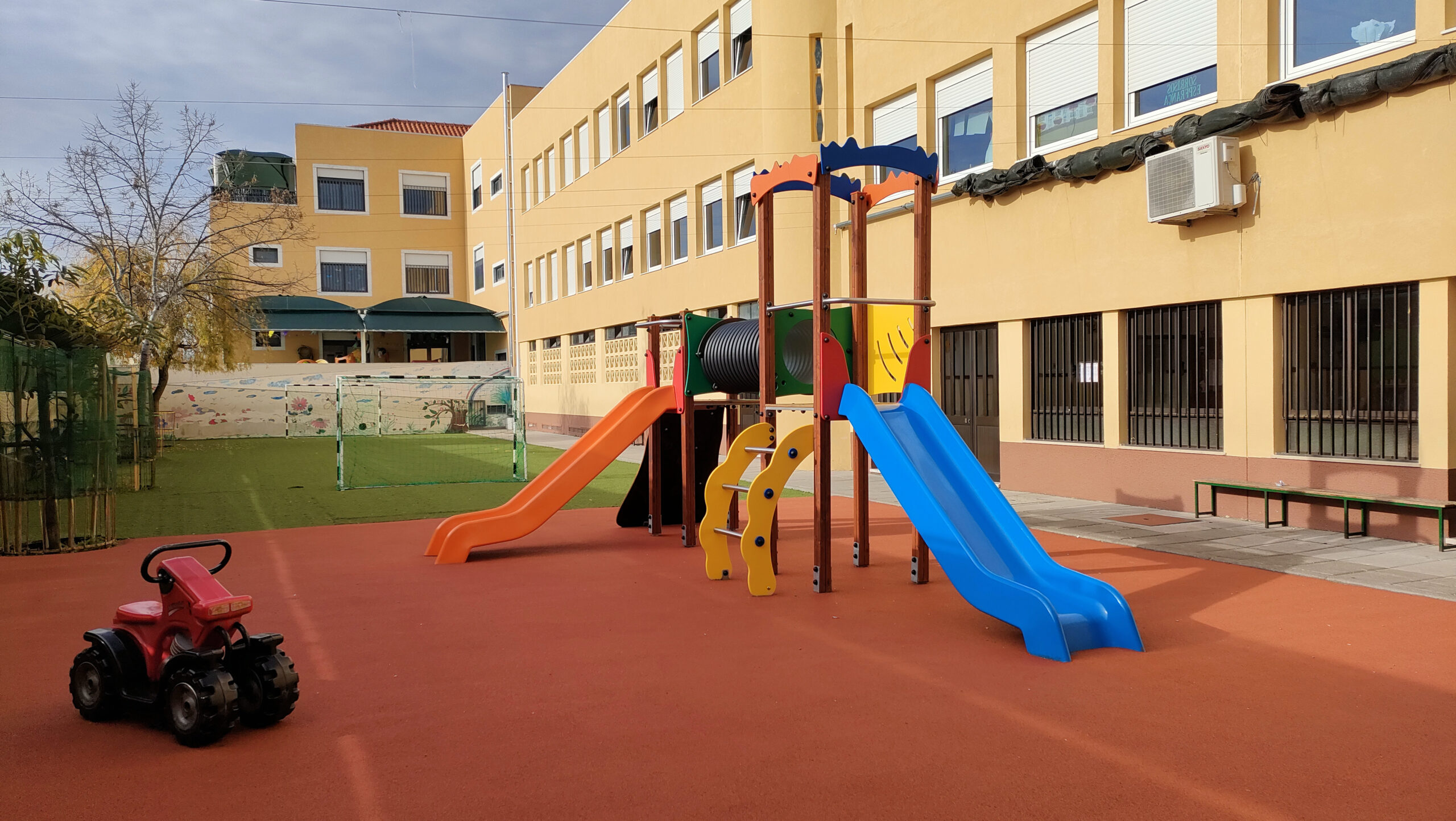 Playground at Externato da Quintinha preschool with slides and climbing equipment