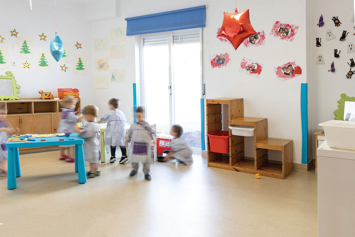 Preschool classroom with children playing and learning