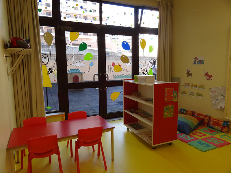 Preschool classroom with colorful furniture and playful decorations