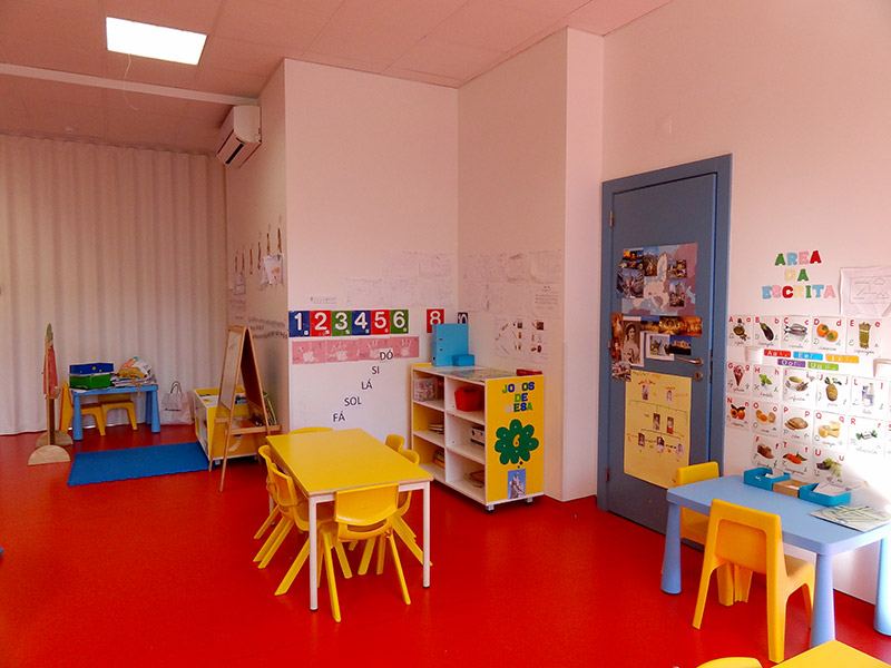 Preschool classroom with colorful furniture and educational materials