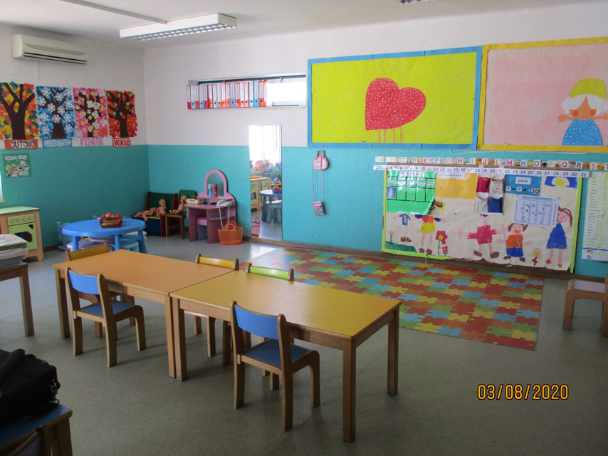 Preschool classroom with colorful furniture and educational materials