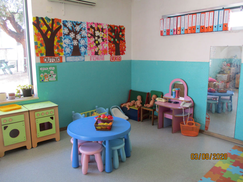 Preschool classroom with colorful furniture and educational materials
