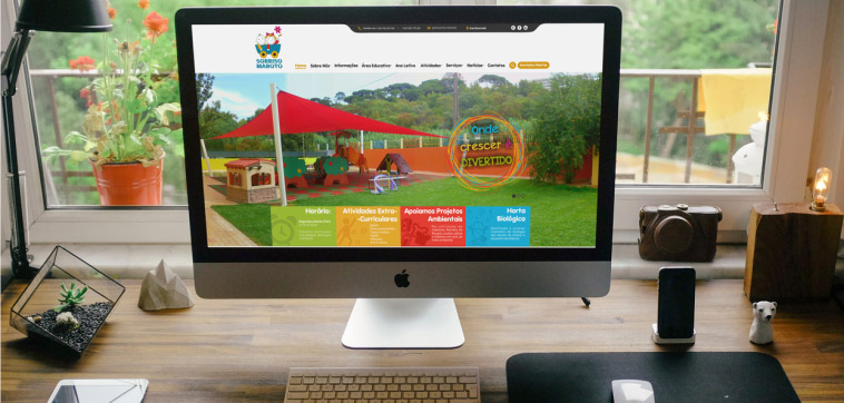 Sorriso Maroto preschool website displayed on a computer screen, showing images of the playground and other facilities.