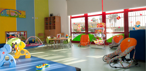 Preschool classroom with colorful toys and furniture