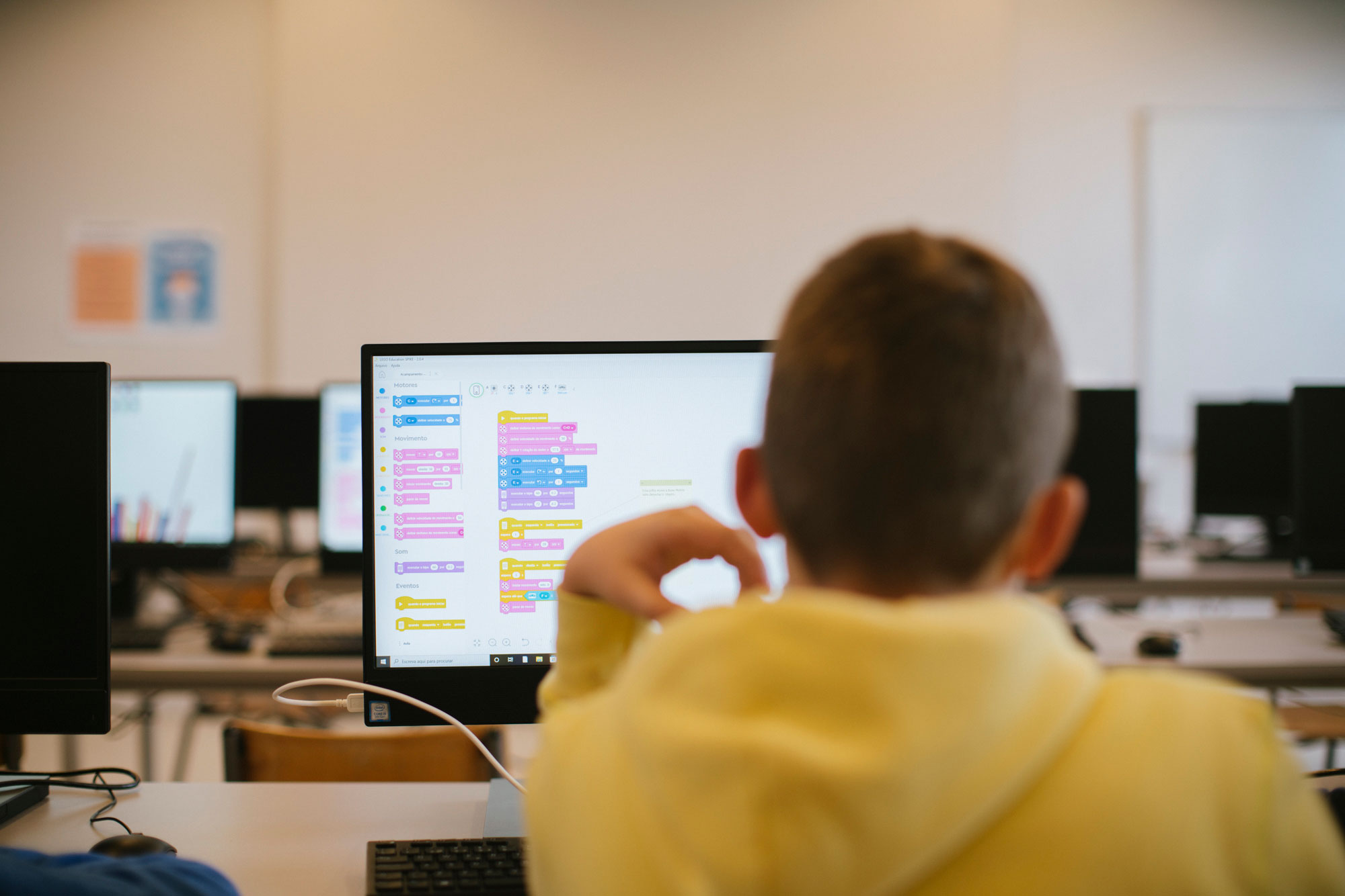 Student using computer for coding or robotics class