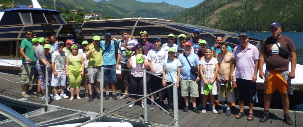 Preschool children and staff on a field trip, enjoying a sunny day by the water