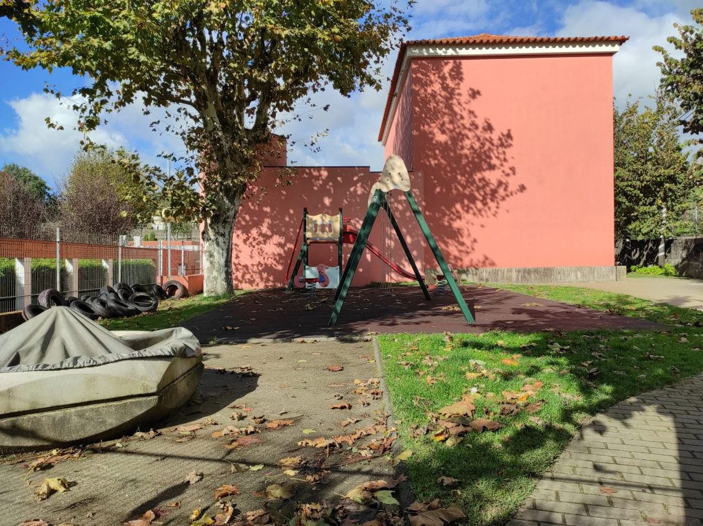 Preschool playground with swings and slide