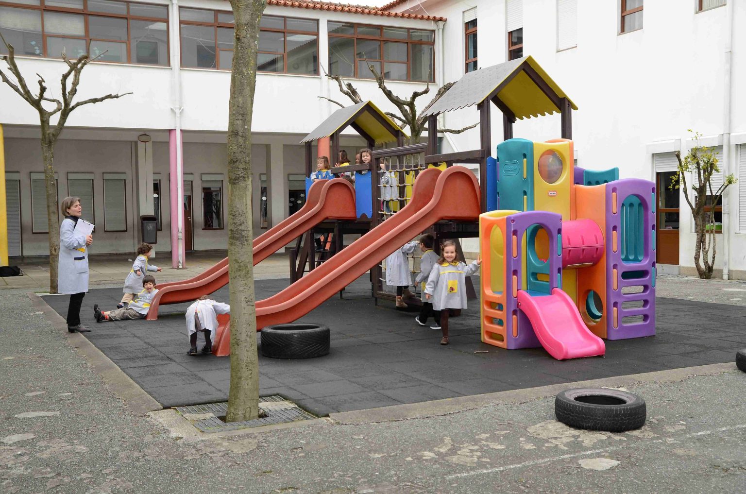 Preschool children playing on a playground at Instituto D. João Novais E Sousa