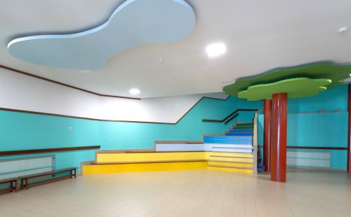 Colorful preschool interior with stairs and playful design elements