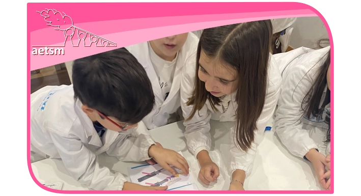 Preschool children in white coats conducting a science experiment