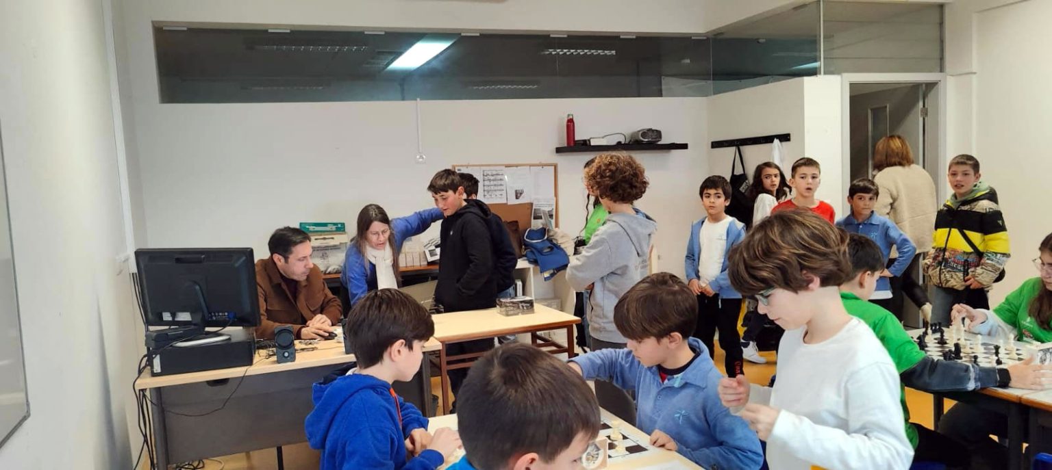 Preschool children playing chess during a school activity