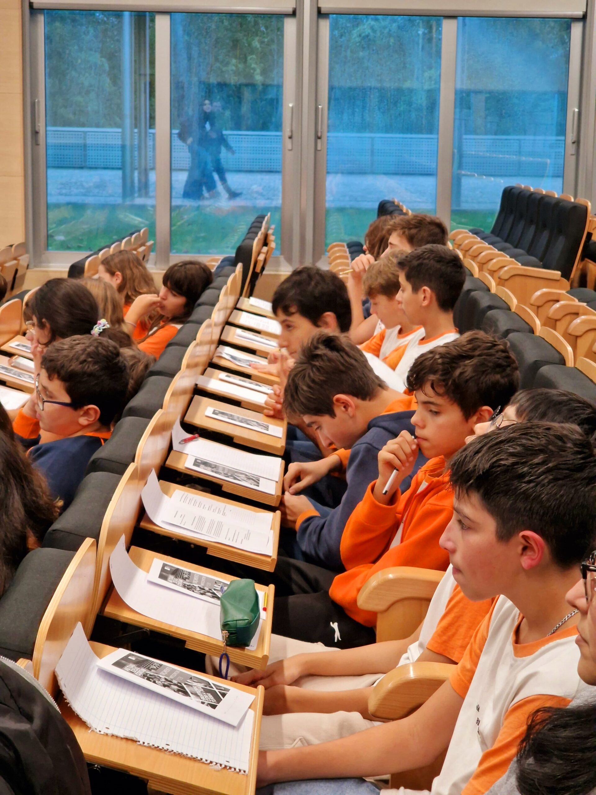Students attentively listening during a class at Colégio Bissaya Barreto.