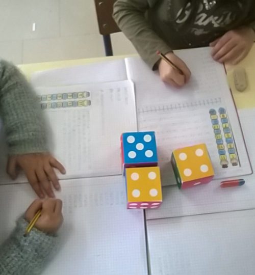 Preschool children learning math with large dice