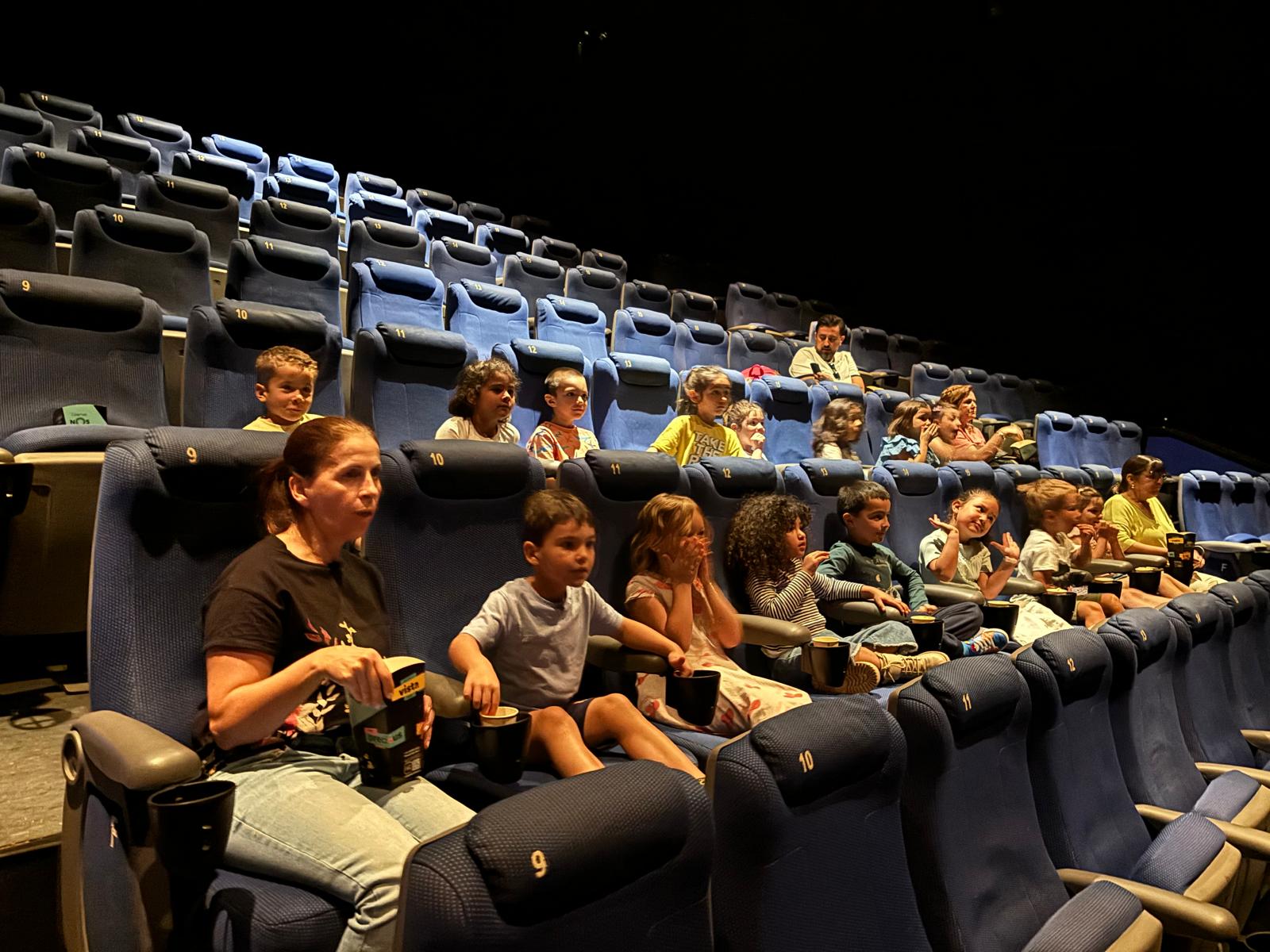 Preschool children enjoying a movie at the cinema