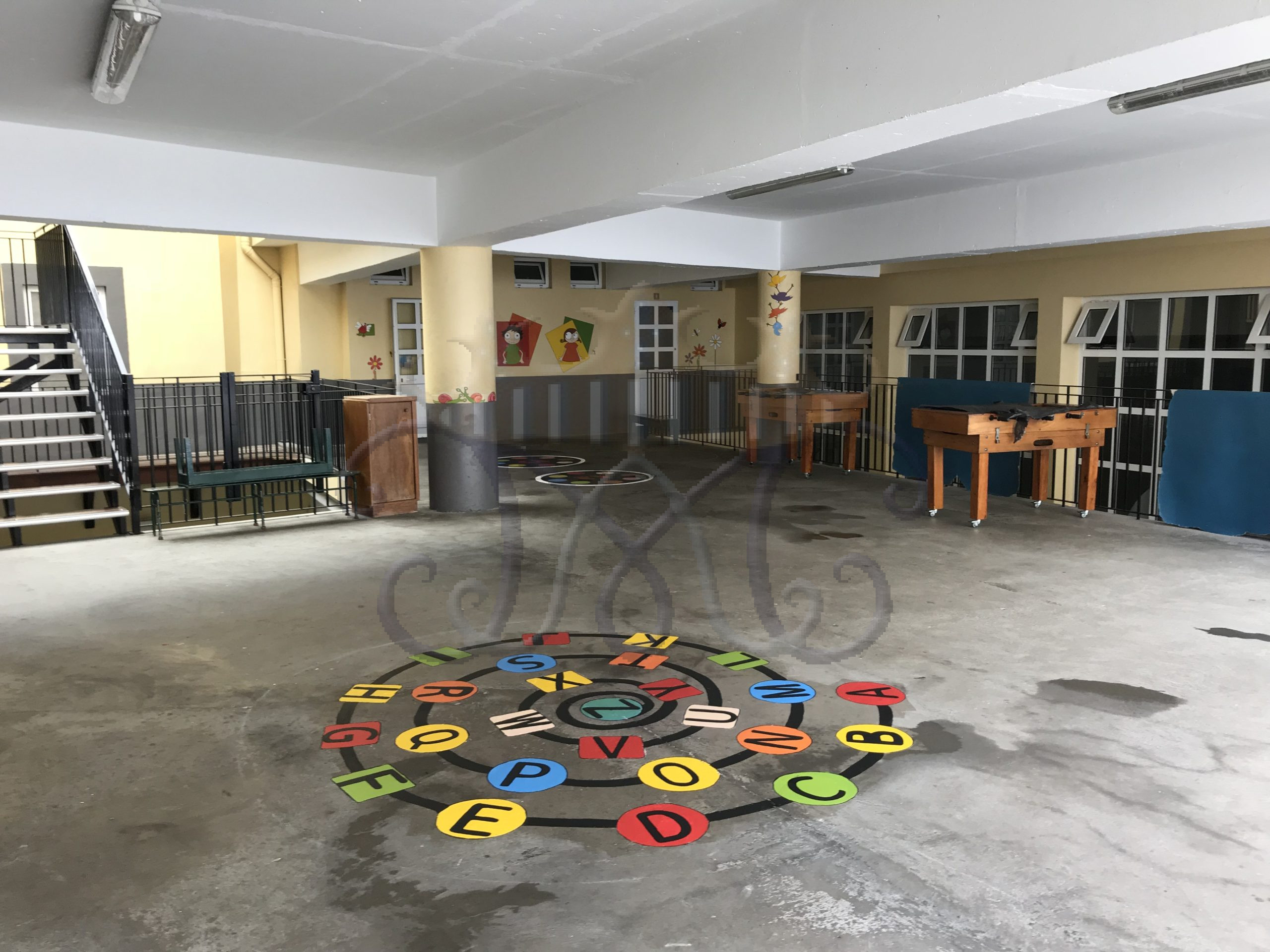 Preschool playground with alphabet floor game