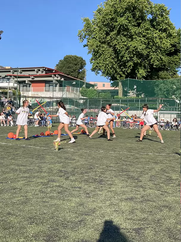 Students participating in a playful outdoor game at Escola Básica Dr. Costa Matos