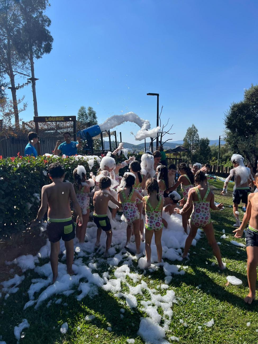 Preschool children playing in a foam party