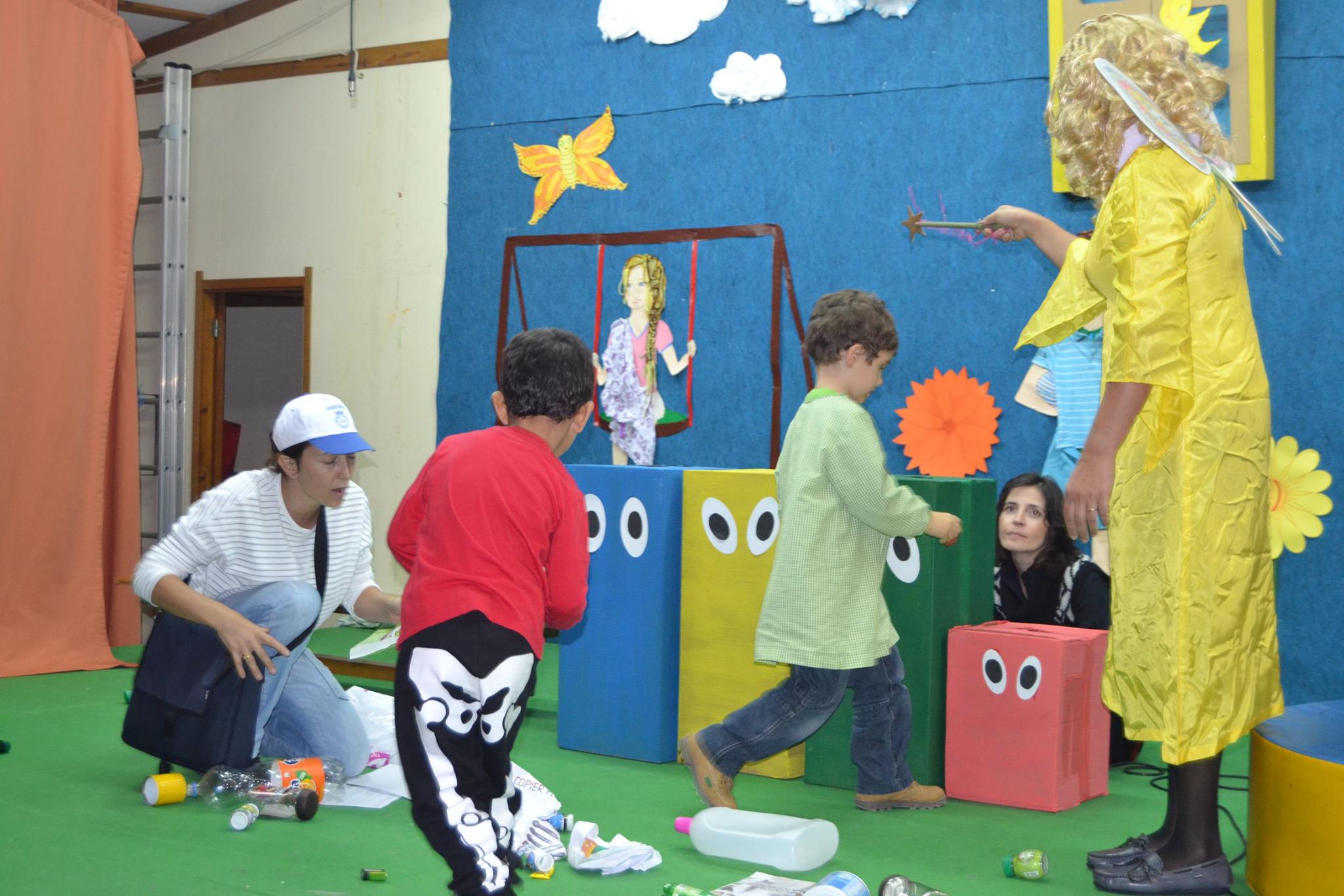Preschool children participating in a recycling-themed play or activity.