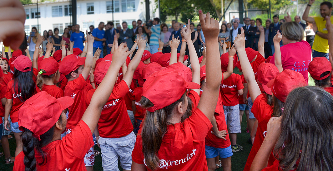 Preschool children raising their hands in a group