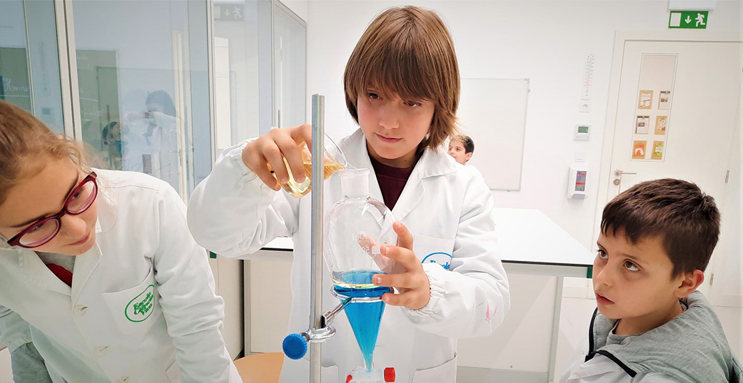 Preschool children conducting a science experiment
