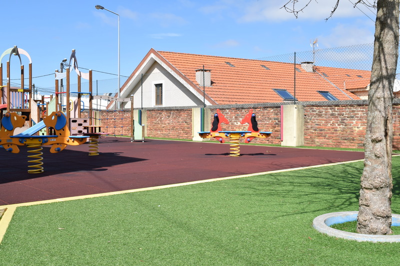 Preschool playground with colorful play equipment