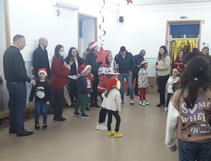 Preschool children and staff celebrating Christmas