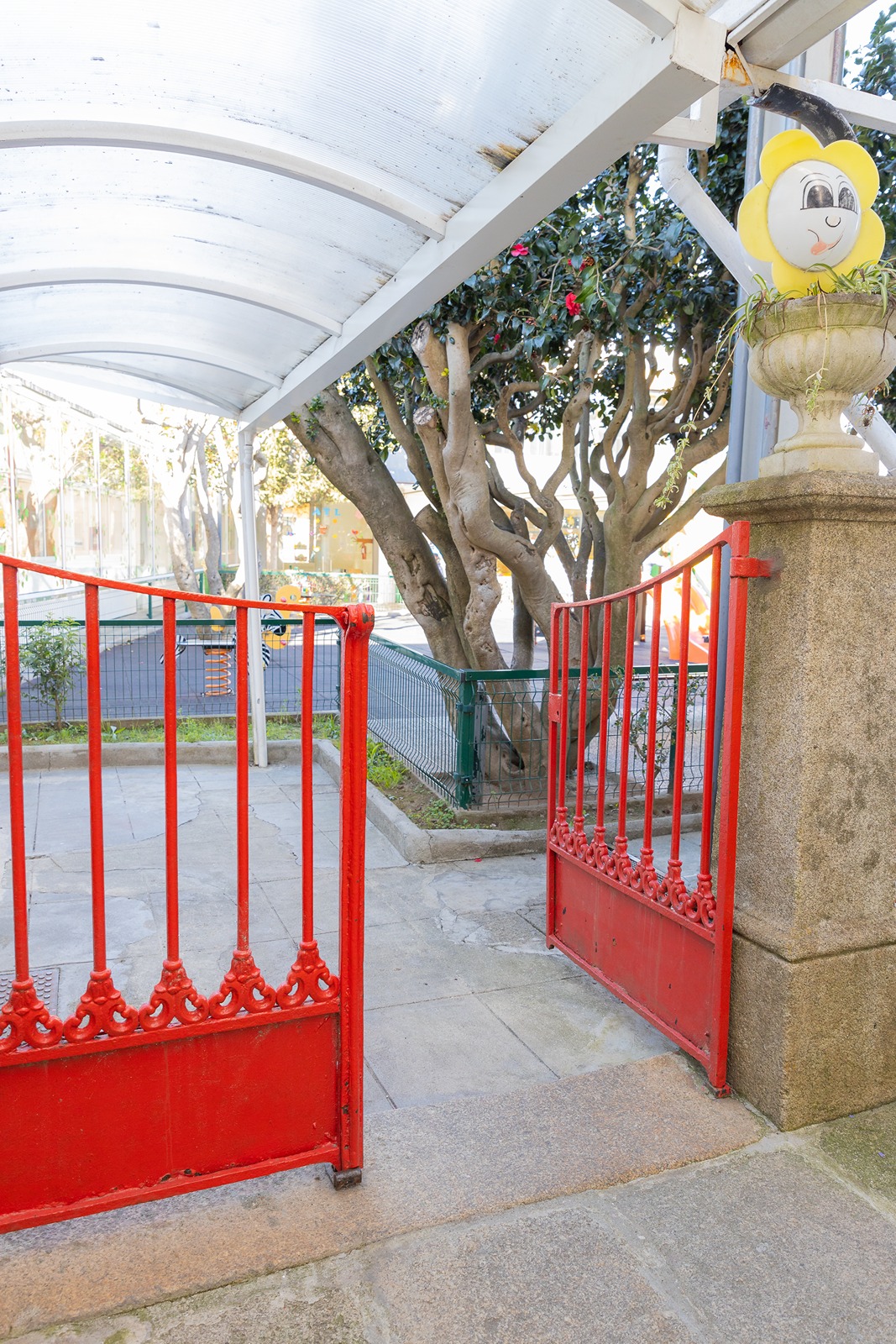 Red gate entrance to a preschool playground
