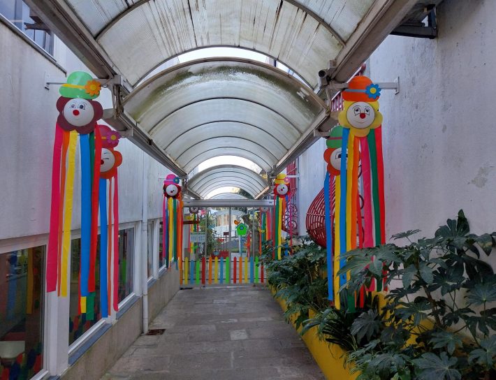 Colorful decorations hanging in a school hallway