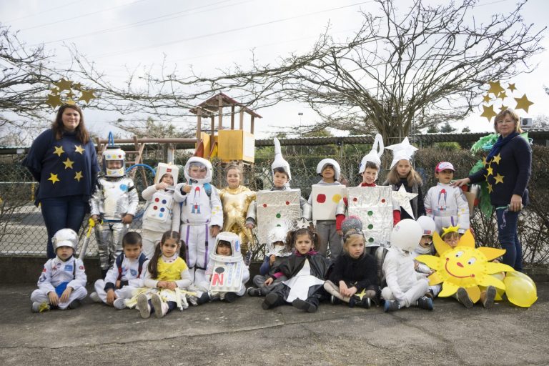 Preschool children dressed in astronaut costumes for a space-themed event