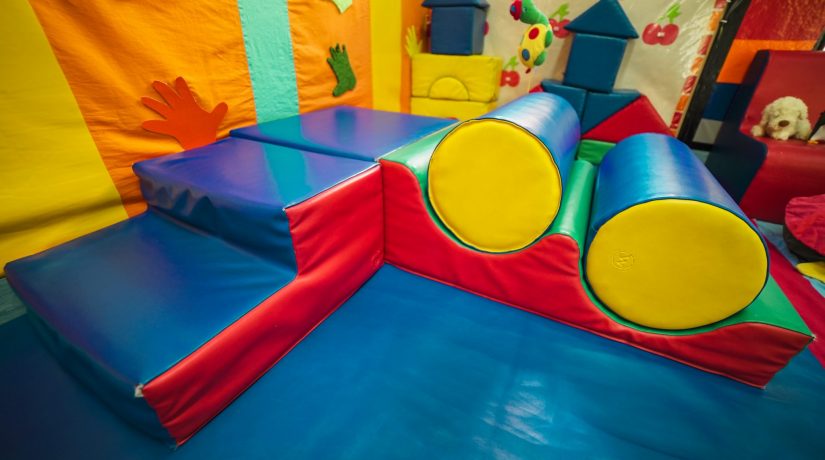 Colorful soft play equipment in a preschool classroom