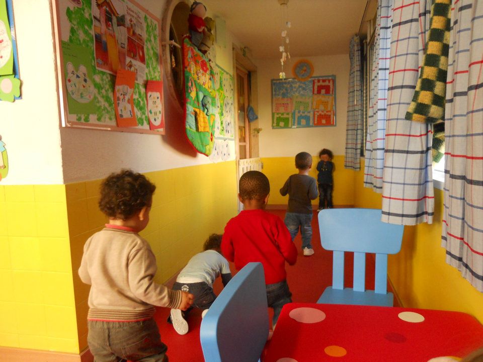 Preschool classroom with children playing and learning