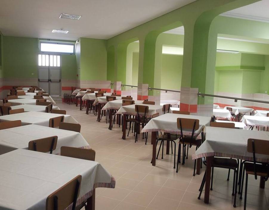 Cafeteria tables and chairs in a school dining hall