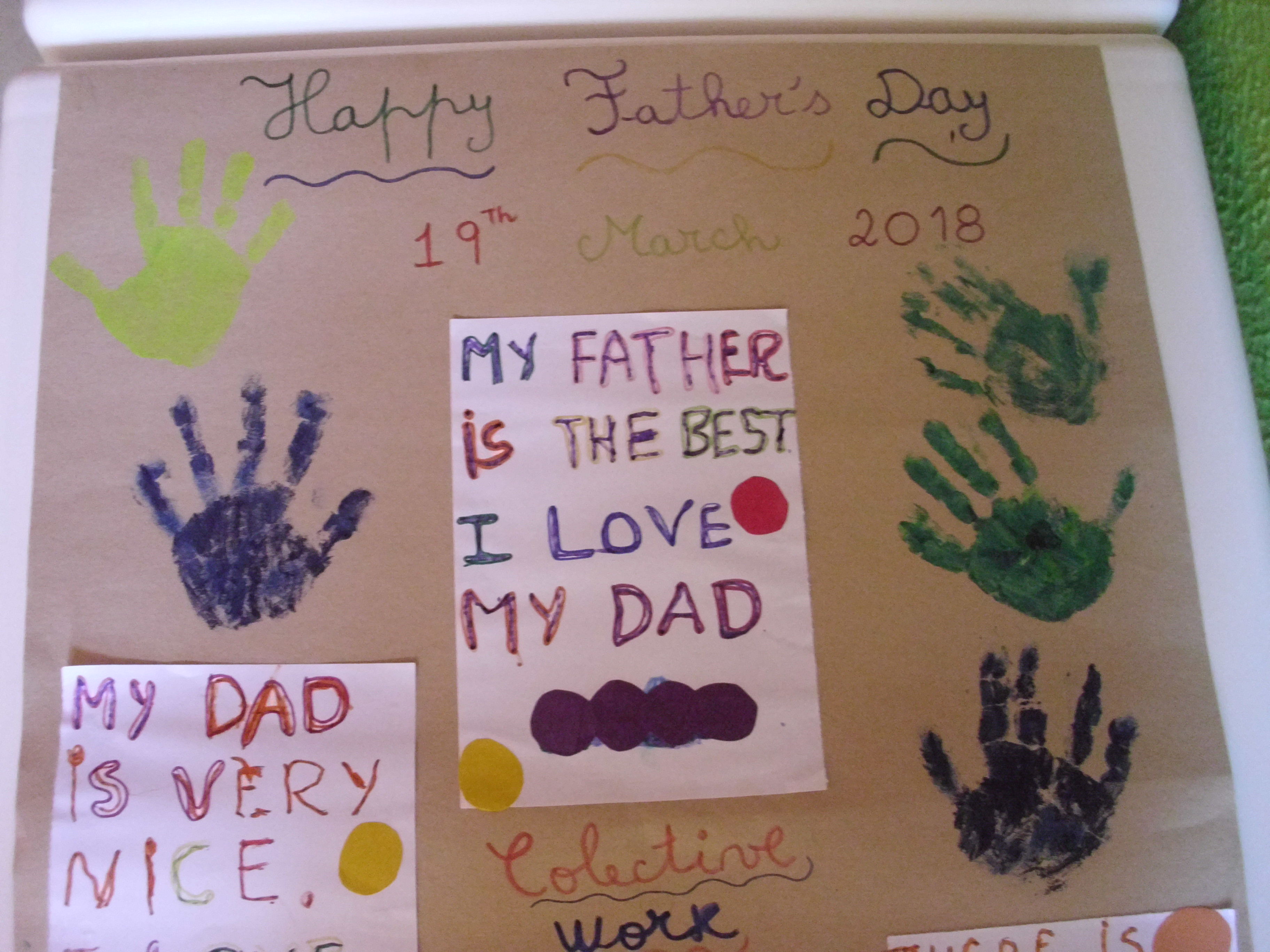 Preschool children's artwork for Father's Day, featuring handprints and messages.