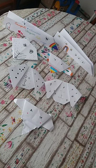 Children's origami creations on a table