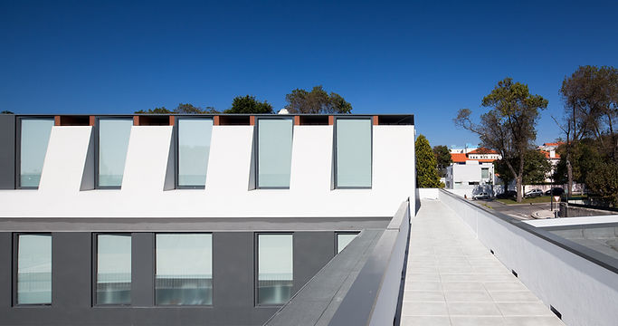 Colégio CEBES school building exterior with modern architecture and walkway